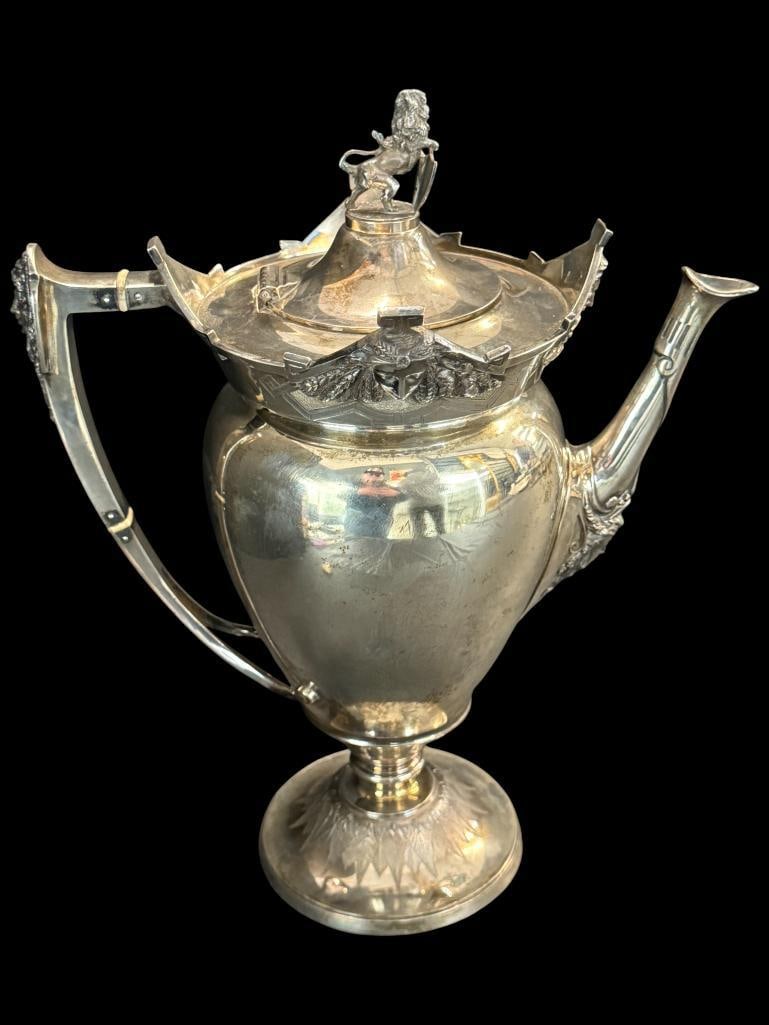 E & Co. Sterling Silver Coffee Pot: E & Co. Sterling Silver Coffee Pot with figural Lion on lid. Approx. 40.5 ozt. Approx. 12 x 10 x 6 inches.