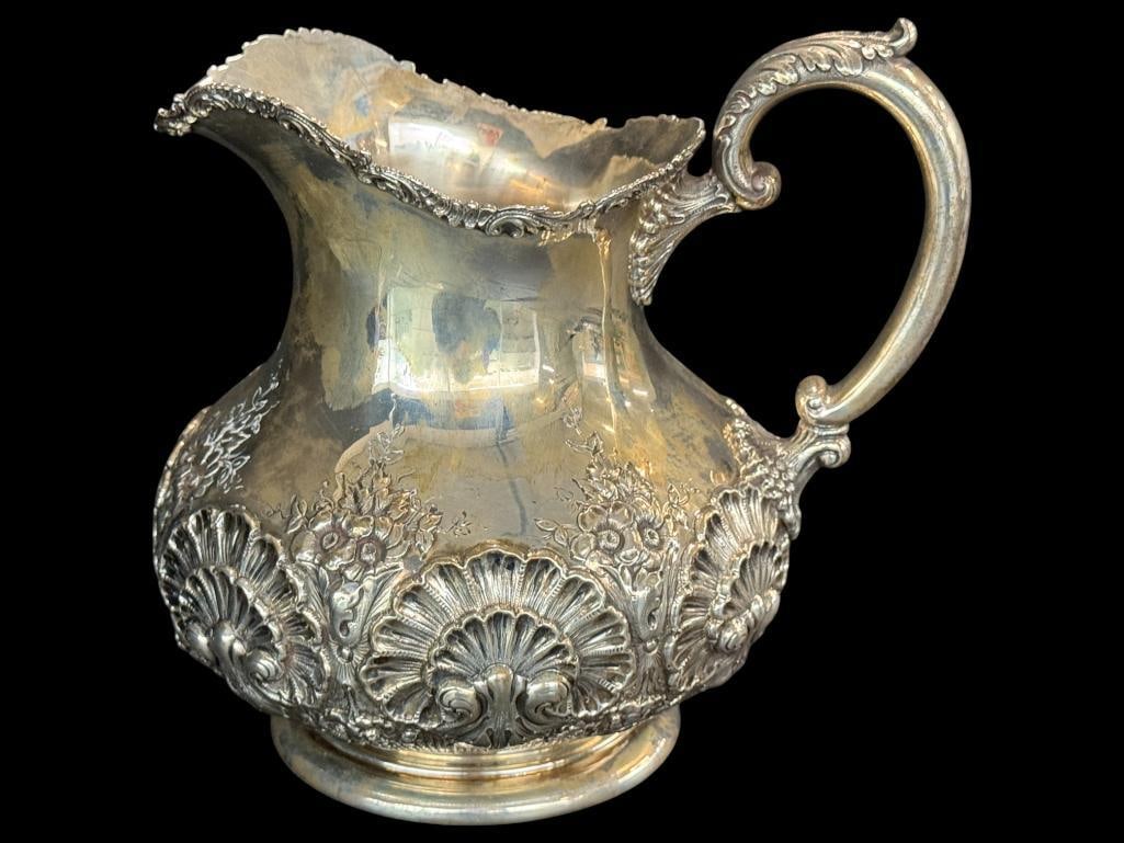 Sterling Silver Pitcher: Theodore B. Starr Sterling Silver Pitcher. Approx. 27.3 ozt. Approx. 8 x 8.5 x 6 inches.