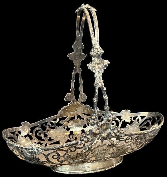 Sterling Silver Handled Basket: Sterling Silver Handled Basket with grapes design. Approx. 26 ozt. Approx. 12 x 12 x 6 inches.