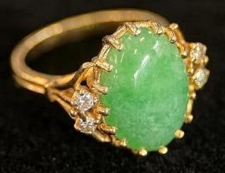 14k Gold ring with Jadeite and Diamonds: 14k Gold ring with Jadeite and Diamonds. Approx. 4.8 grams. Approx. size 4.75.