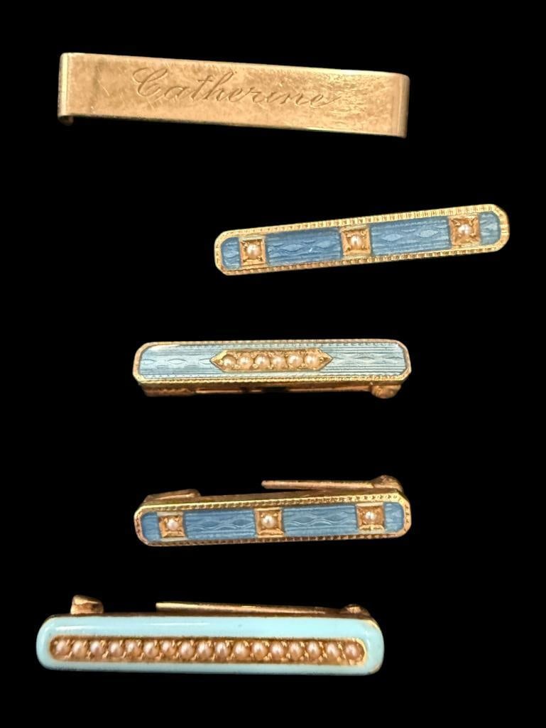 5 14k Gold Pins: 5 14k Gold Pins. Approx. 5.6 grams. One plain pin. 4 enamel pins with seed pearls etc. Came in Cartier box.