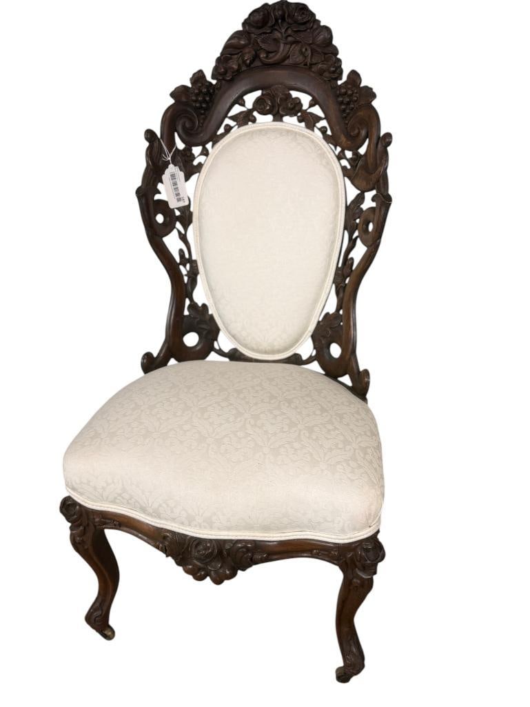 Belter Rosewood chair: Belter rosewood chair. c. 1860.Fountain Elms pattern. Floral crest, reticulated and scrolled foliate back. Approx. 38 x 18 x 18 inches.