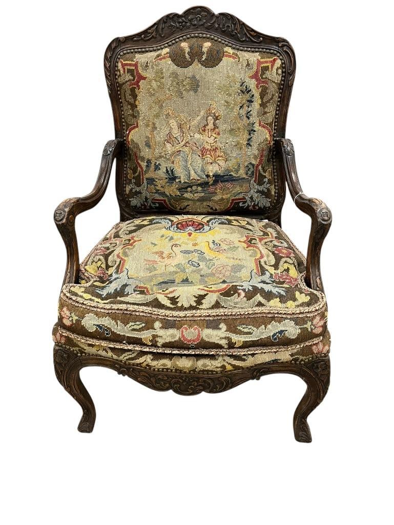 French Chair with Needlepoint: 19th century Carved French Needlepoint armchair. Approx. 42 x 26 x 26 inches.