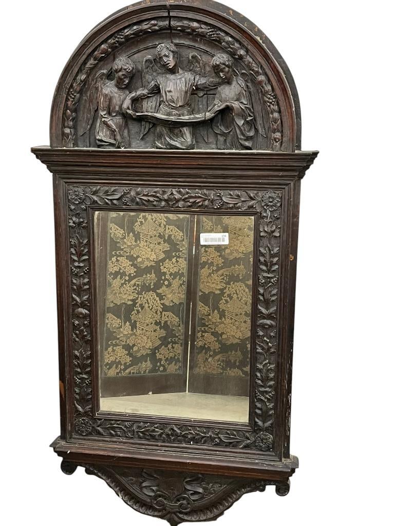 18th Century Carved Oak Mirror: 18th Century Carved Oak Mirror with Angels. Approx. 52 x 27 x 4 inches.