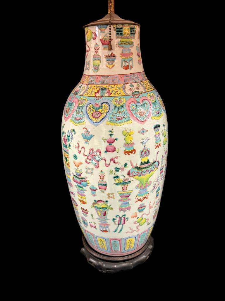Chinese Famille Rose Large vase / lamp: Chinese Famille Rose Large vase / lamp. The vase features a "hundred antiquities" or "precious objects" design. Vase approx. 22 x 9 x 9 inches. With shade and finial approx. 35 inches tall.