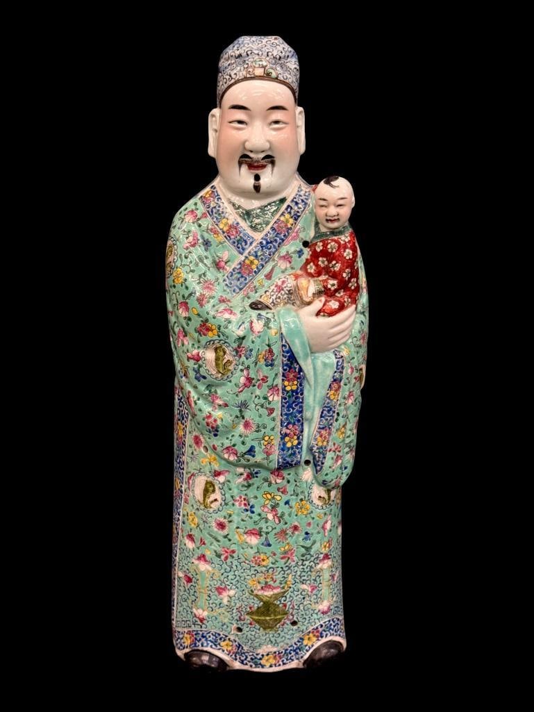 Chinese Famille Rose deity statue: Chinese Famille Rose deity statue. Approx. 26 x 8 x 7 inches.