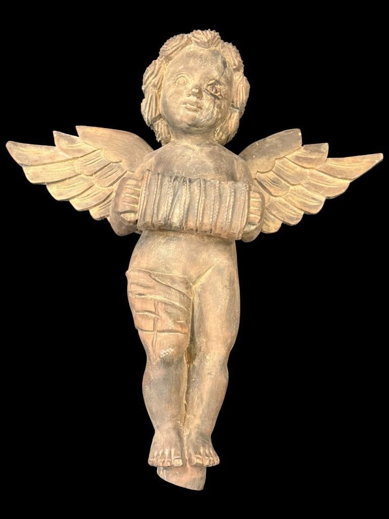 Nicely Carved wood Cherub with Accordion: Nicely Carved wood Cherub playing the Accordion. Approx. 19 x 18 x 6 inches.