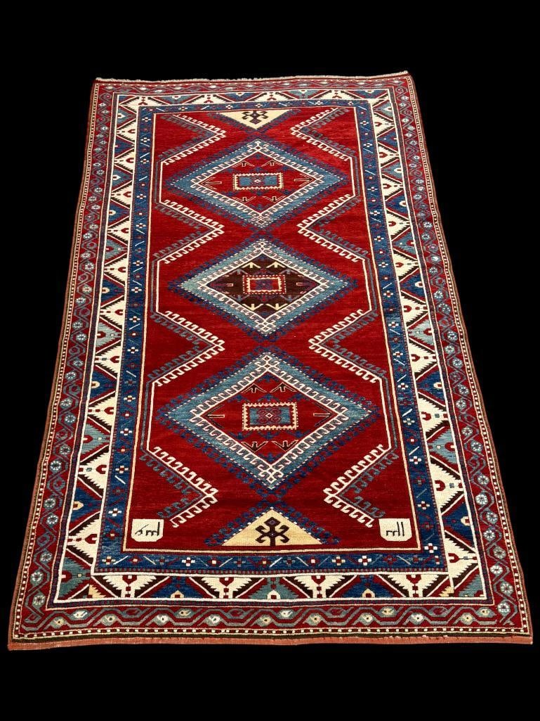 Handmade Persian Kazak rug c. 1910: Handmade Persian Kazak rug. With signatures. Fabulous condition. Approx. 9'8" x 5'9".