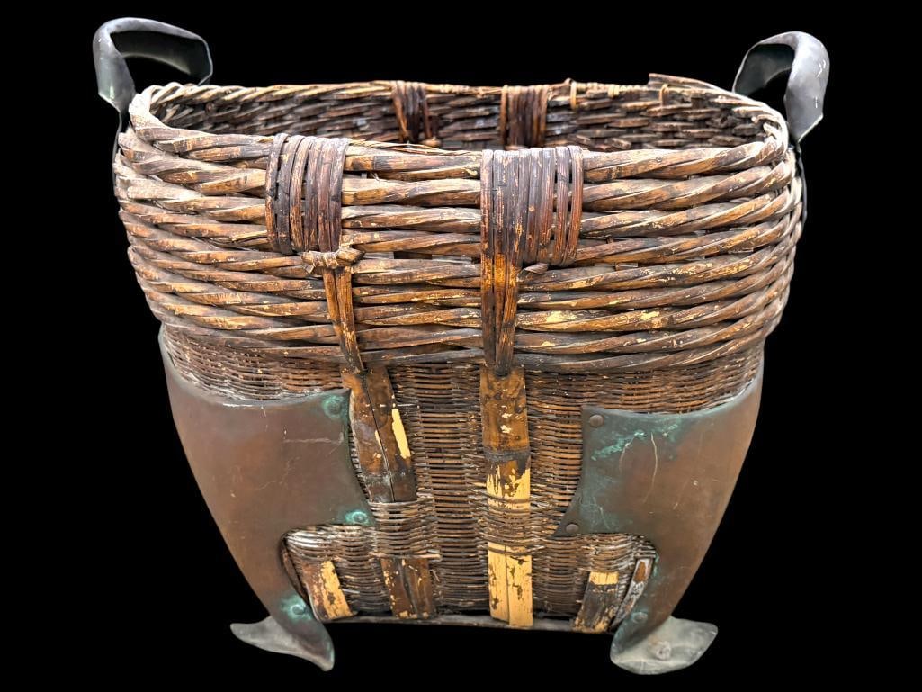 Large Woven Basket with Copper Mounts: Large Woven Basket with Copper Mounts. Approx. 19 x 23 x 22 inches.