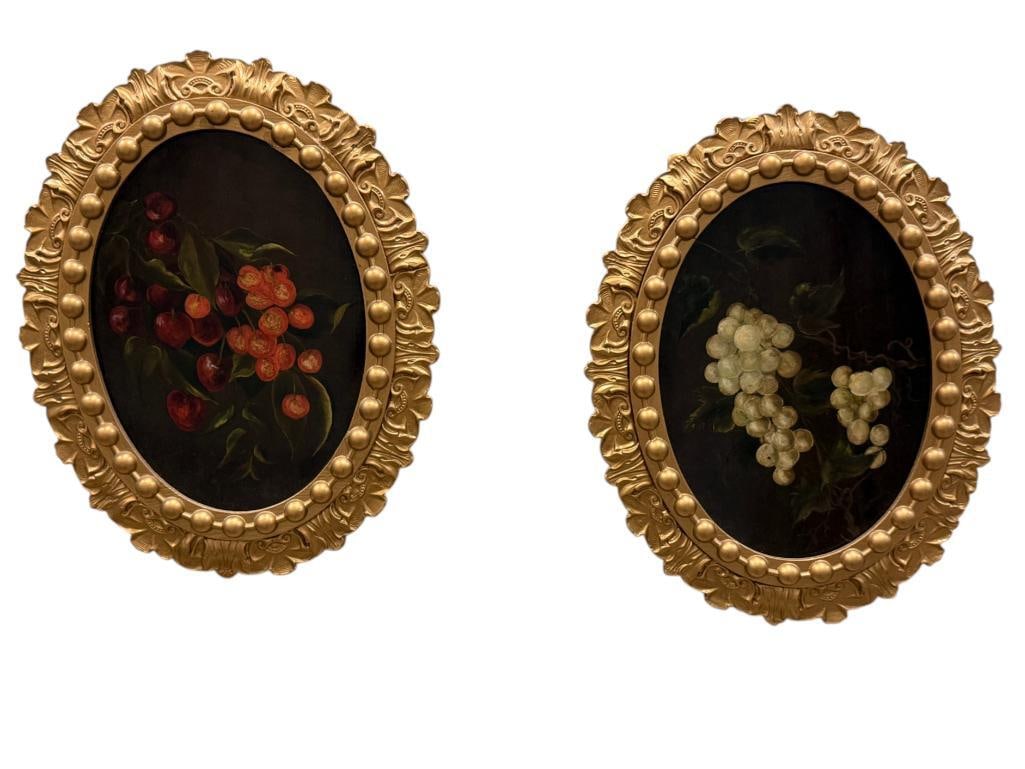 Pair of oil on wood panels: Pair of oil on wood panels, Cherries and Grapes in gold gilt oval frames. Approx. 12 x 8 inches. Frame approx. 17 x 13 inches.