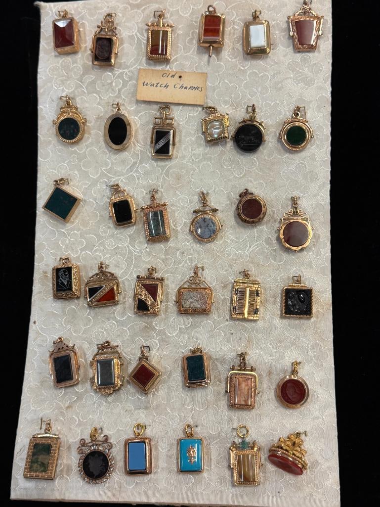 36 GF Watch Charms c. 1890: 36 Gold Filled Salesman Samples / New Old Stock Watch Charms c. 1890. Featuring various hardstones, Carnelian, Mother of Pearl and more.
