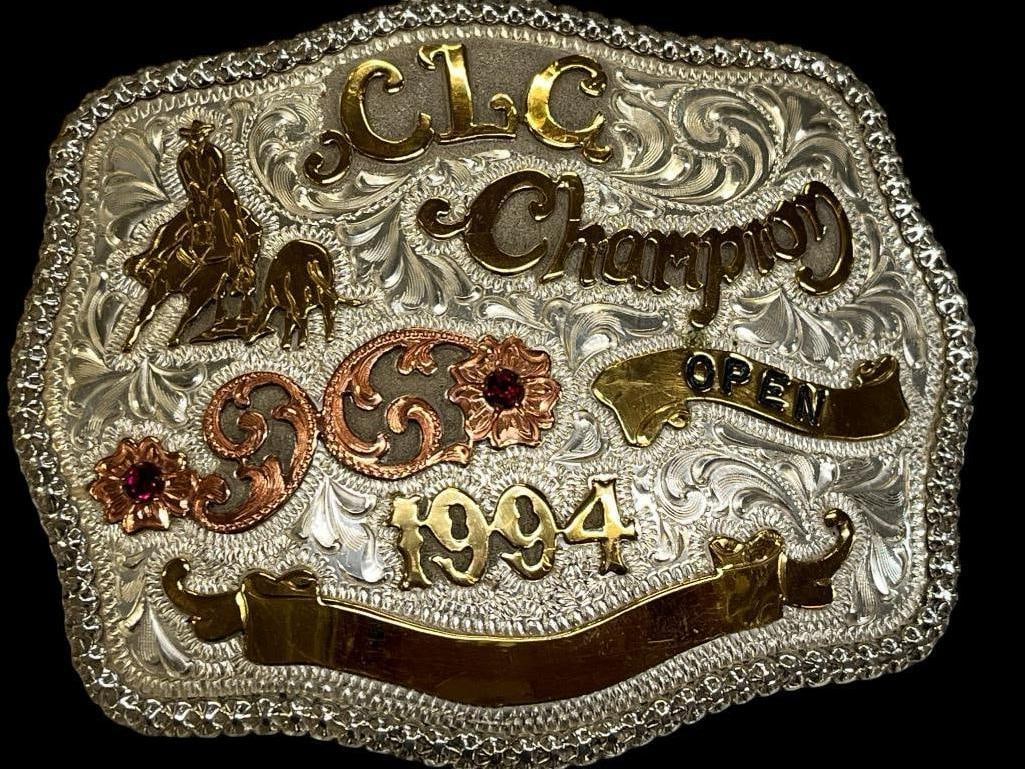 Sterling 1994 Rodeo Belt Buckle: 1994 CLC Champion Rodeo Belt Buckle by Western Trails. Marked Sterling. Approx. 4.3 ozt.