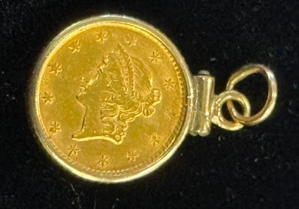 $1 U.S. Gold Coin: $1 U.S. Gold Coin in bezel. Back has been defaced, year unknown.