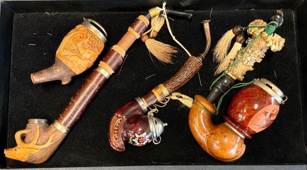 4 Carved wood pipes: 4 Carved wood pipes. Some with deer carvings. largest approx. 11 inches.