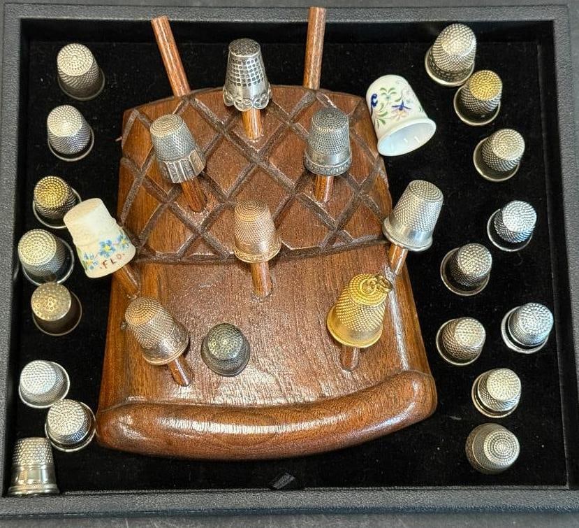 Collection of thimbles and holder: Collection of thimbles and holder.