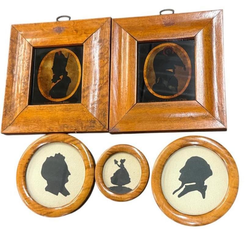 5 Silhouettes in wood frames: 5 Silhouettes in wood frames. Largest frame approx. 7 x 6.25 inches.