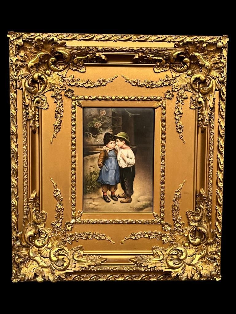 Wagner signed painting on porcelain: Wagner signed painting on porcelain in gold gilt frame. Titled "A Little Secret". Approx. 5.5 x 3.75 inches. Frame approx. 14 x 12 inches.