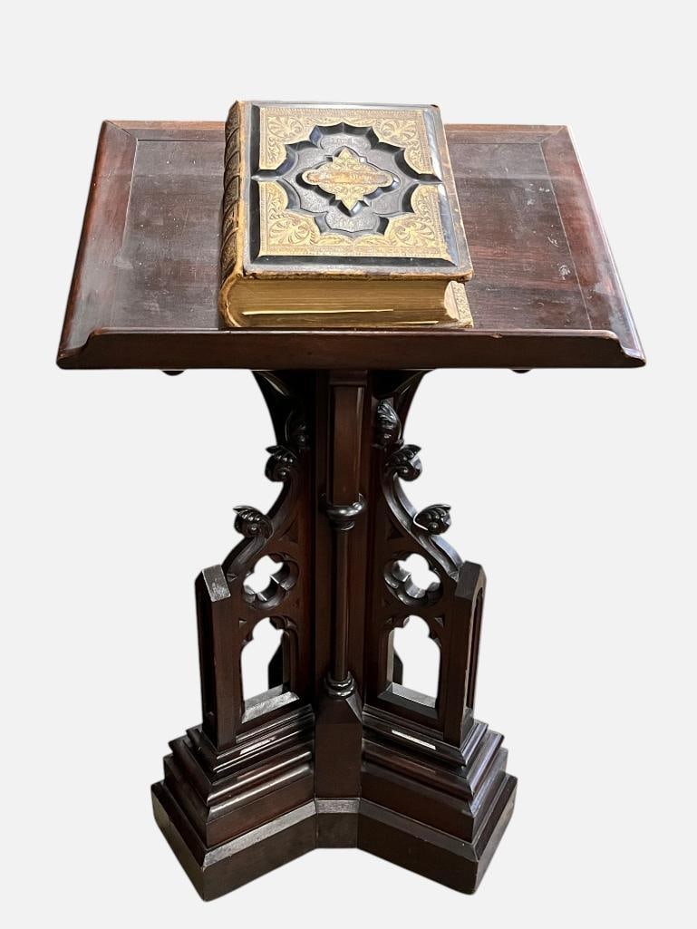 Gothic Revival Pedestal Lectern and Bible references book: Carved Walnut Gothic Revival Pedestal Lectern and Bible references book. Approx. 43 x 26 x 20 inches.