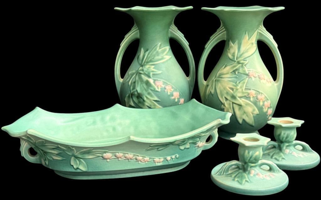 Roseville Pottery Bleeding Heart pieces: Roseville Pottery Bleeding Heart Candlesticks, bowl and vases. 5 pieces total. Vase approx. 10 x 6 x 6 inches.