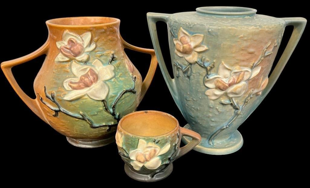 Roseville Pottery Magnolia vases and cup: Roseville Pottery Magnolia vases and cup. 3 pieces. Largest approx. 9 x 9 x 9 inches.