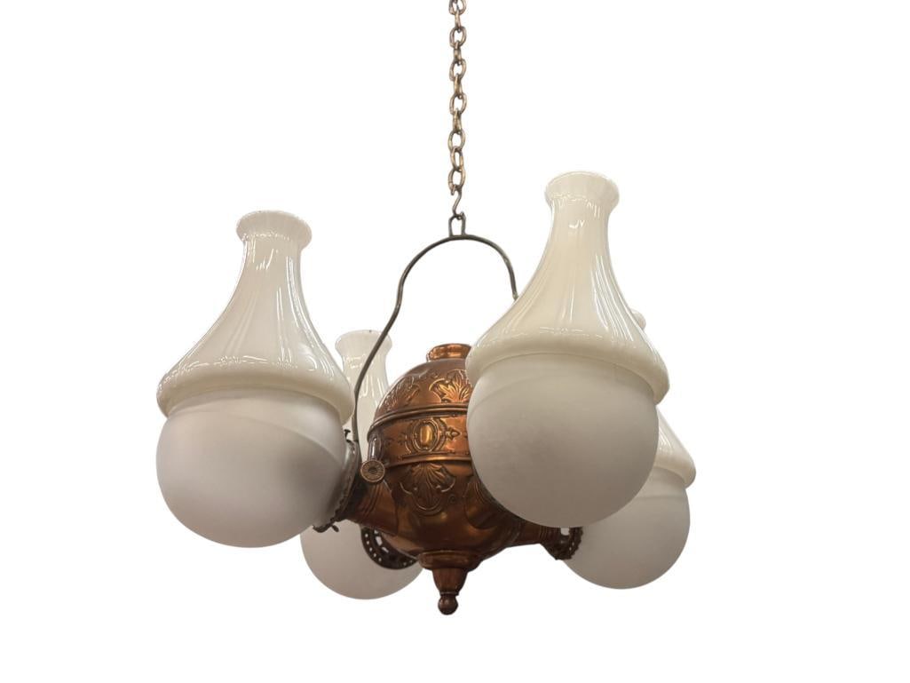 Angle Lamp Co. 4 globe chandelier: Angle Lamp Co. 4 globe chandelier. Fleur-de-lis model. Has been electrified. Approx. 18 x 24 x 24 inches.