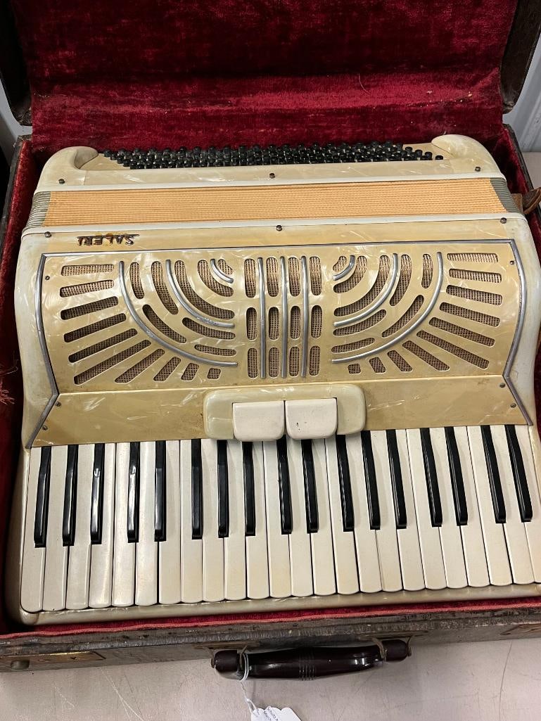 Saleri Piano Accordion: Saleri Piano Accordion with cream pearloid finish. Case approx. 20 x 18 x 9 inches.
