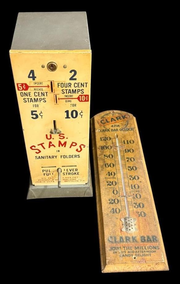 U.S. Stamp machine and Clark Bar Thermometer: U.S. Stamp machine and Clark Bar Thermometer. 2 pieces. Stamp machine approx. 15 x 6 x 6 inches.