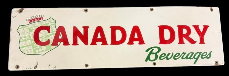 Canada Dry Beverages porcelain enamel sign: Canada Dry Beverages porcelain enamel sign. Approx. 24 x 7 inches.