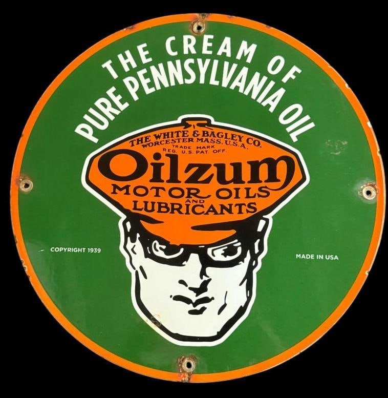 Oilzum porcelain enamel sign: Oilzum porcelain enamel sign. Approx. 12 inches.