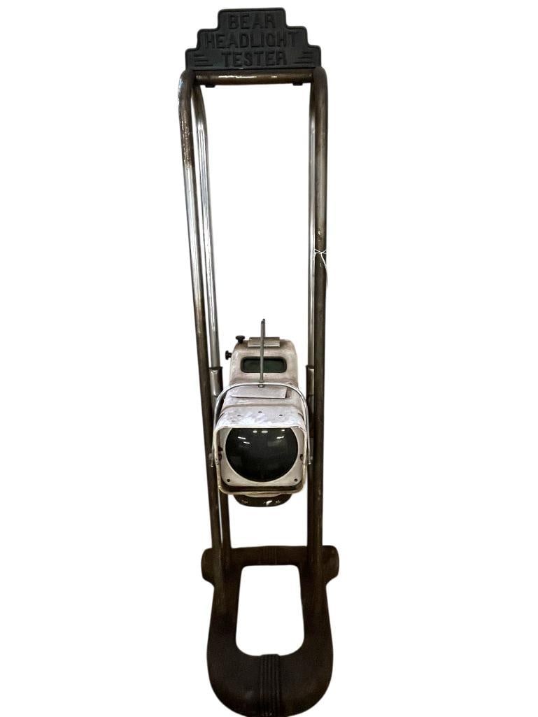Bear Headlight Tester on Art Deco stand: Bear Headlight Tester on Art Deco stand. Approx. 64 x 19 x 21 inches.
