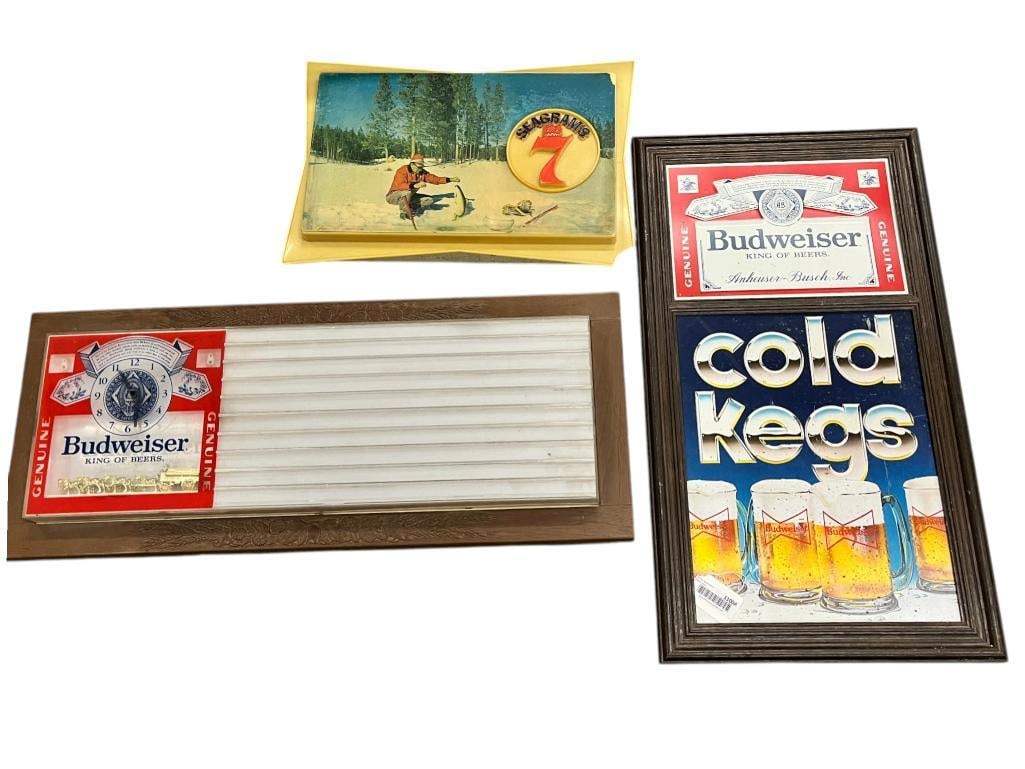 Budweiser and Seagram's 7 signs: Budweiser and Seagram's 7 signs. 3 pieces. Budweiser light approx. 33 x 14 x 6 inches.