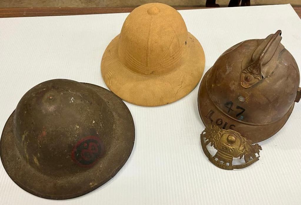 Doughboy Helmet, French Fire Helmet etc.: Doughboy Helmet, French Fire Helmet and Pith helmet. 3 pieces.