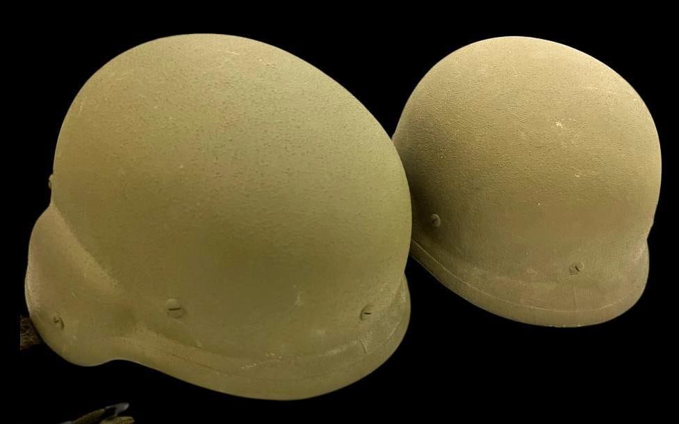 2 U.S. Military Kevlar helmets: 2 U.S. Military Kevlar helmets.