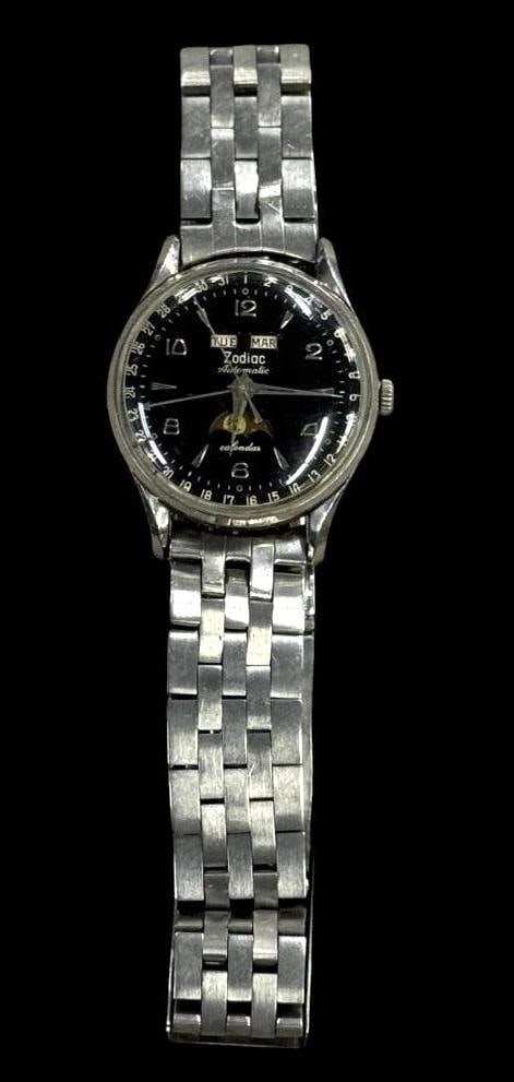 Zodiac Automatic Moon Phase Calendar Wristwatch: Zodiac Automatic Moon Phase Calendar Wristwatch, in working order at time of cataloging.