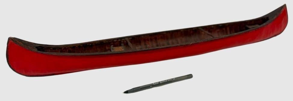 Model of a wood canoe: Model of a wood canoe. Approx. 26 x 5 inches.