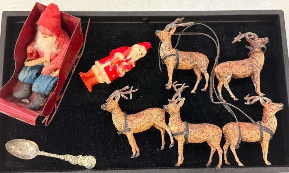 Group of Christmas figures incl early santa, etc: 5 Metal Reindeer marked Germany, Early Plastic Santa Claus, Early Santa with Felt jacket and pants, tin sleigh, and happy new year spoon