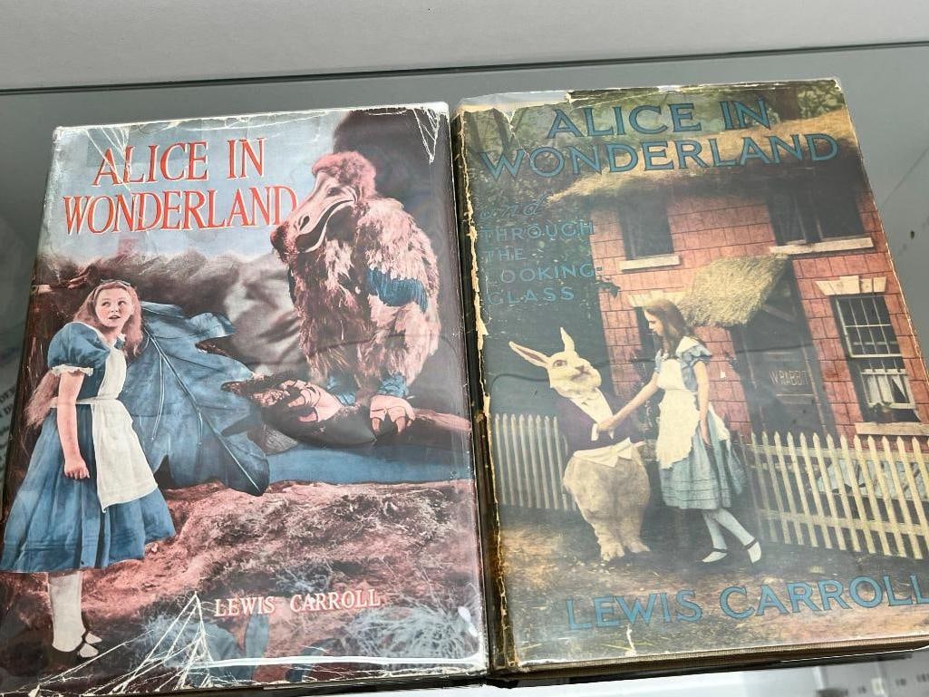 2 Alice in Wonderland Photoplay books in dust jackets: 2 Alice in Wonderland Photoplay books in dust jackets. Grosset & Dunlop c. 1916 and Collins ( first UK photoplay ) c. 1933.