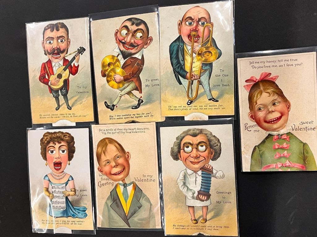 7 Mechanical Postcards: Group of 7 Mechanical Postcards incl. googly eye figures of men and woman