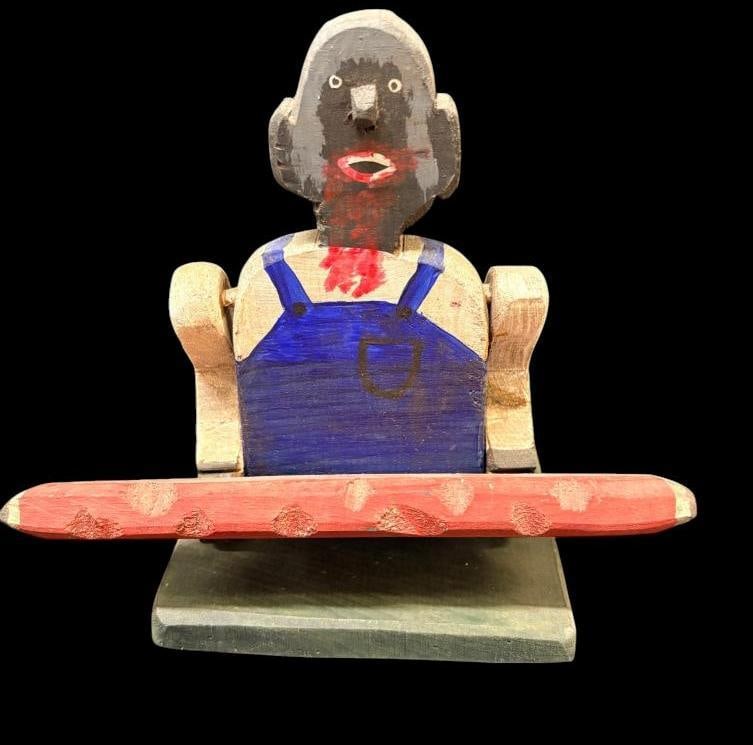 2 Black Americana sculptures: 2 Black Americana wood sculptures. One signed Tony Smaistrla. Approx. 8 x 9 x 6 inches.