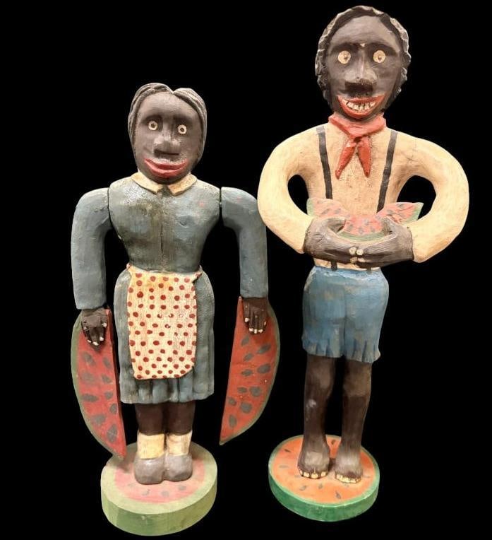 Bill & Phyllis Duffy signed Black Americana wood carvings: 2 Bill & Phyllis Duffy signed Black Americana sculptures. Man and woman with watermelon. Approx. 21 x 5 x 5 inches.
