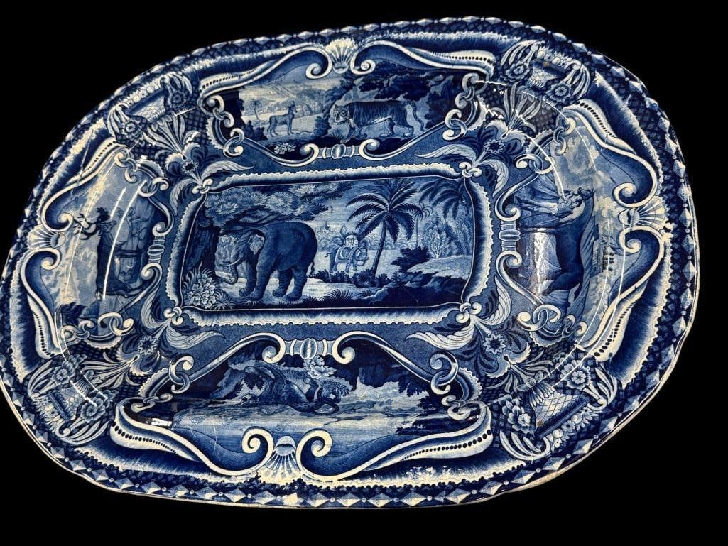 Ihall Quadrupeds cobalt blue platter: Ihall Quadrupeds cobalt blue platter with animal designs. Including elephants, horse, tiger and more. Approx. 19 x 15 inches.