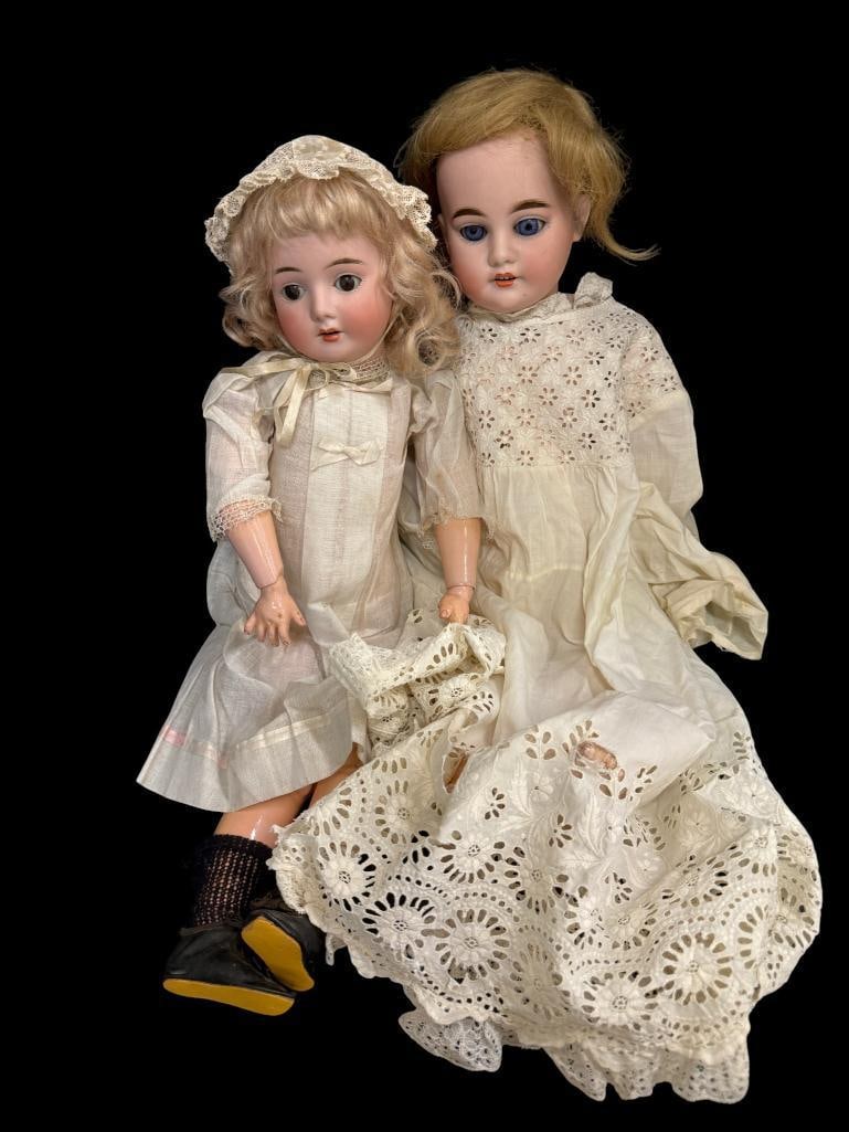 2 German porcelain dolls: 2 German porcelain dolls. One marked Schoenau & Hoffmeister. Approx. 20 inches.
