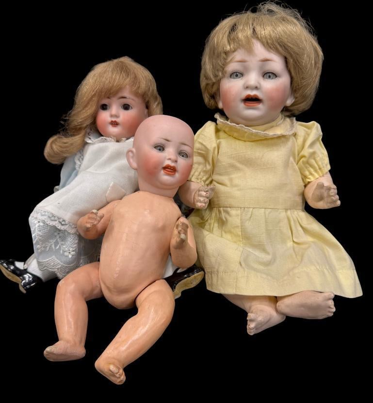 Group of 3 small porcelain dolls: Group of 3 small porcelain dolls. Largest approx. 12 inches.