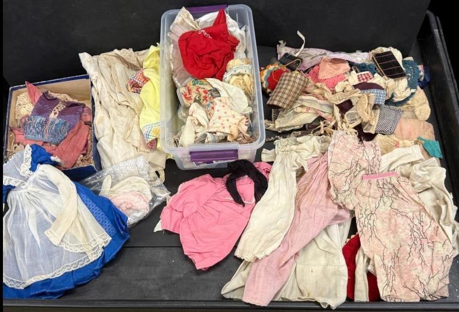 Group of antique doll clothes: Group of antique doll clothes.