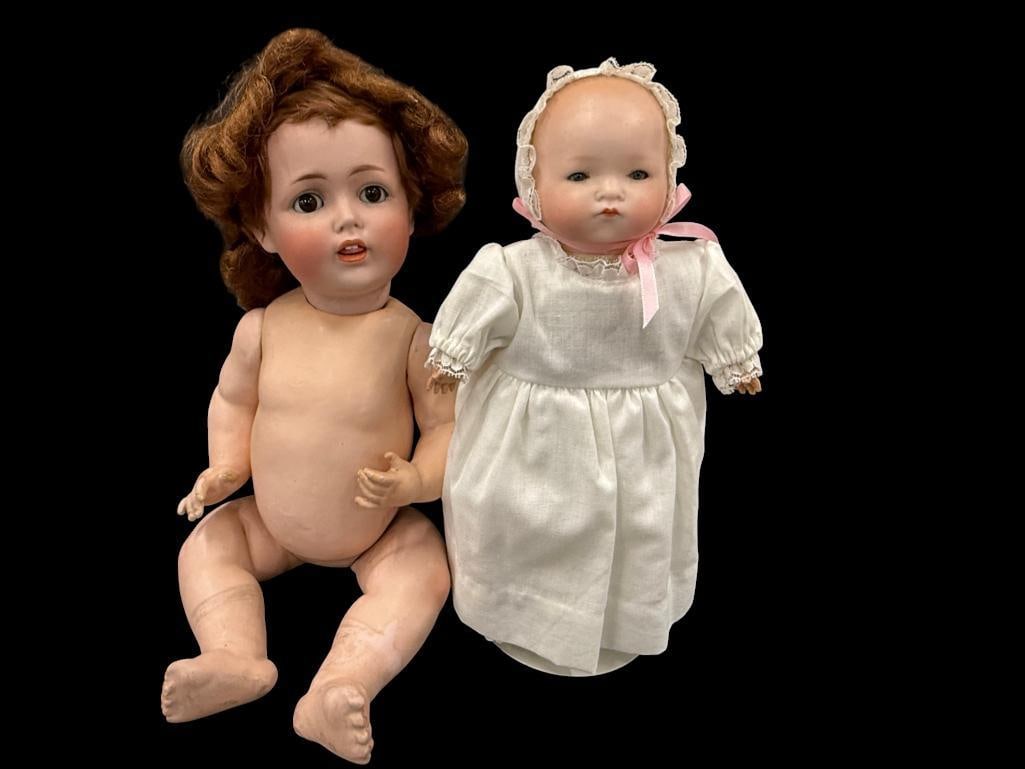 2 porcelain baby dolls: 2 porcelain baby dolls. larger approx. 16 inches.