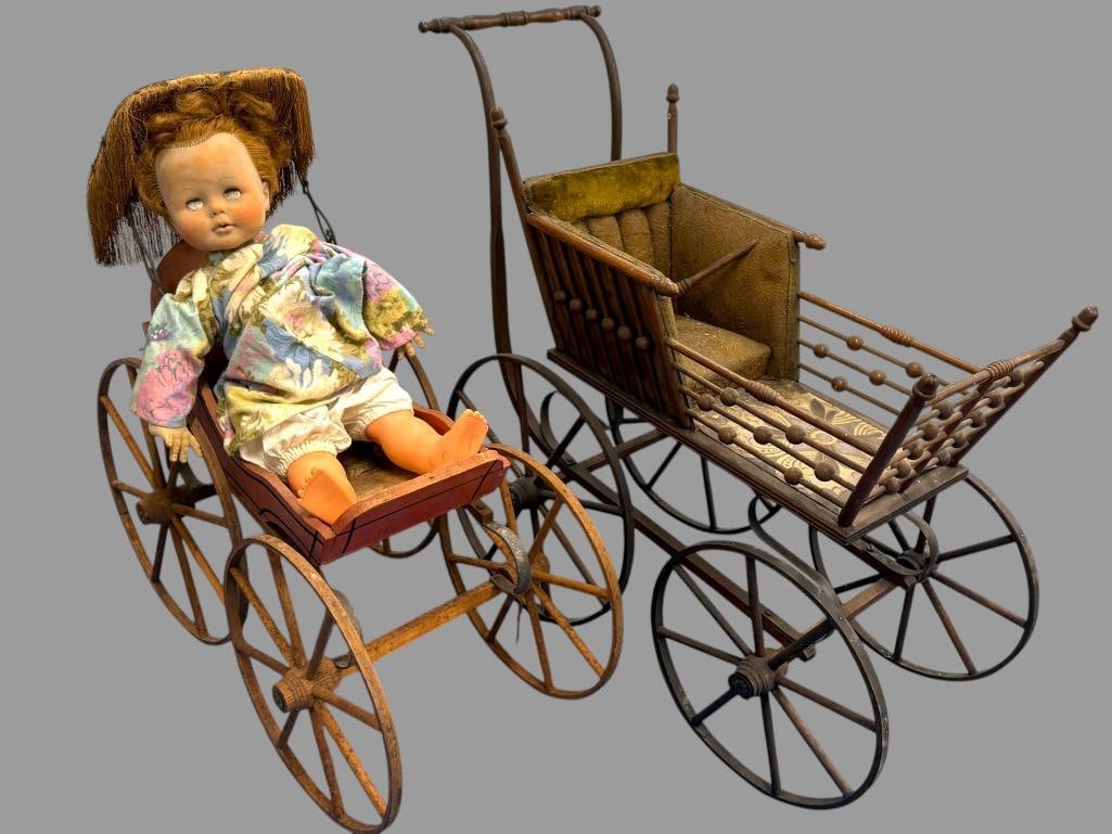 2 Antique doll carriages and doll: 2 Antique doll carriages and doll. 3 pieces. Largest approx. 29 x 36 x 18 inches.