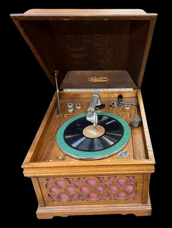 Silvertone Phonograph and records: Silvertone Phonograph and records. Approx. 20 records. Approx. 16 x 18 x 22 inches.