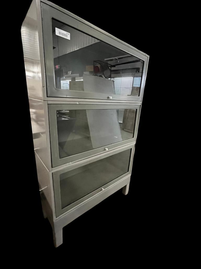 3 Section Metal Barrister Bookcase: 3 Section Metal Barrister Bookcase. Approx. 55 x 33 x 14 inches.