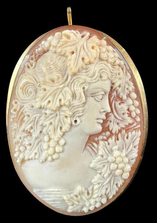Large Cameo set in 18k Gold: Large Finely Carved Cameo set in 18k Gold. Approx. 2.25 x 1.5 inches.