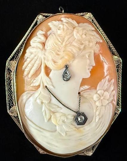 Cameo with Diamonds set in 14k Gold: Finely Carved Large Cameo with Diamonds set in 14k Gold. Approx. 2.25 x 1.75 inches.